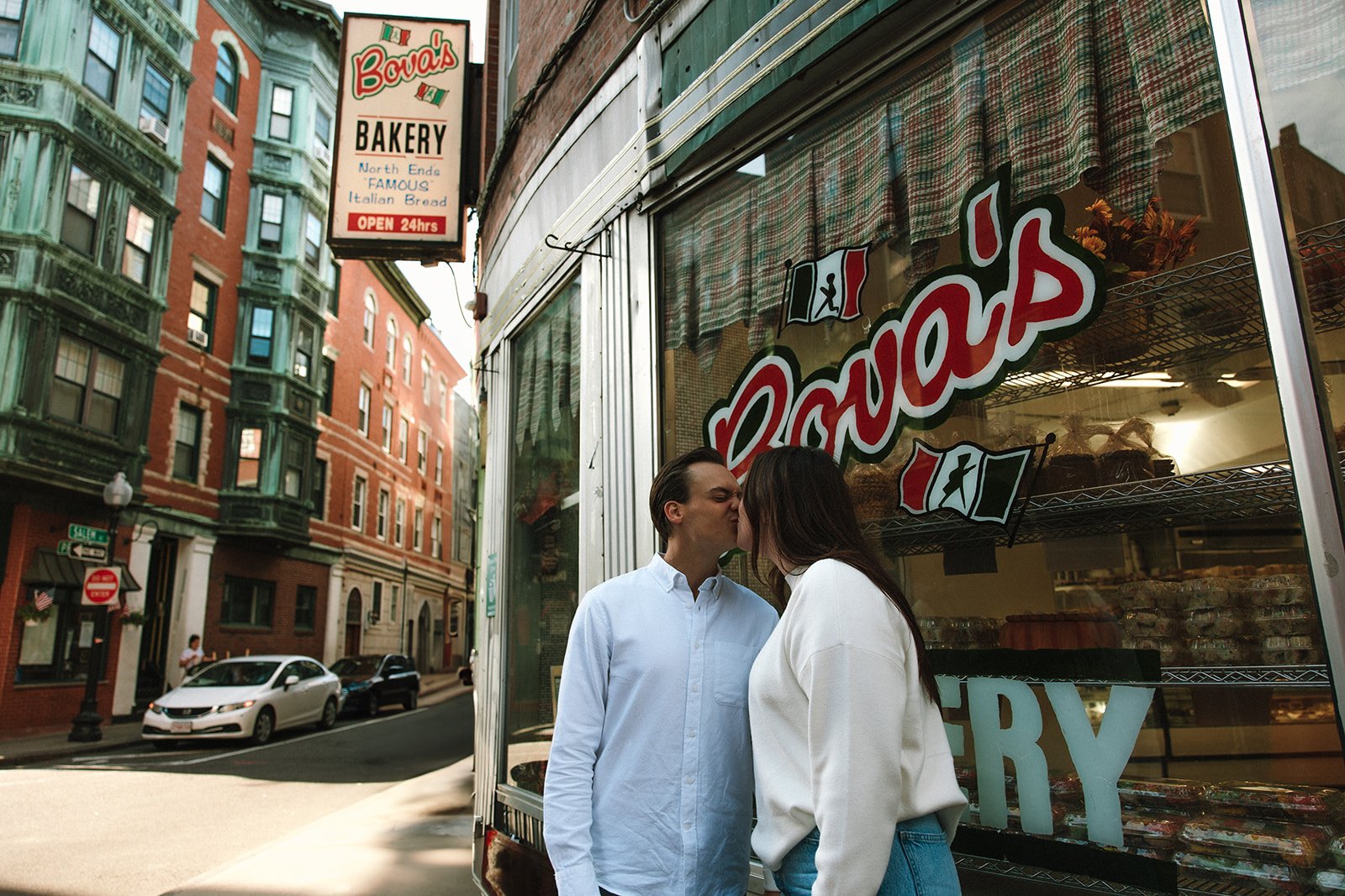 Stunning couple share a kiss during their Boston engagement shoot