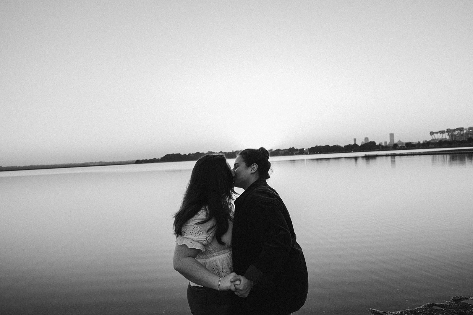 A beautiful couple kisses during their Castle Island engagement photos!