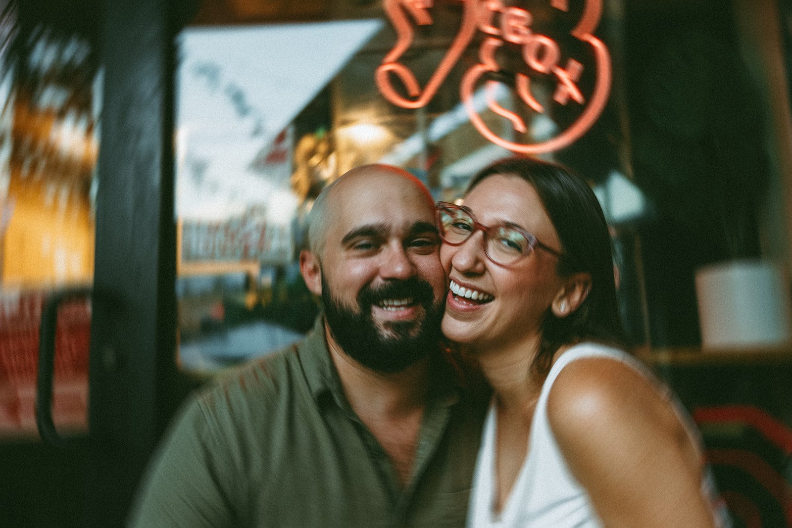 Couple pose together and share a smile during their Boston engagement photos