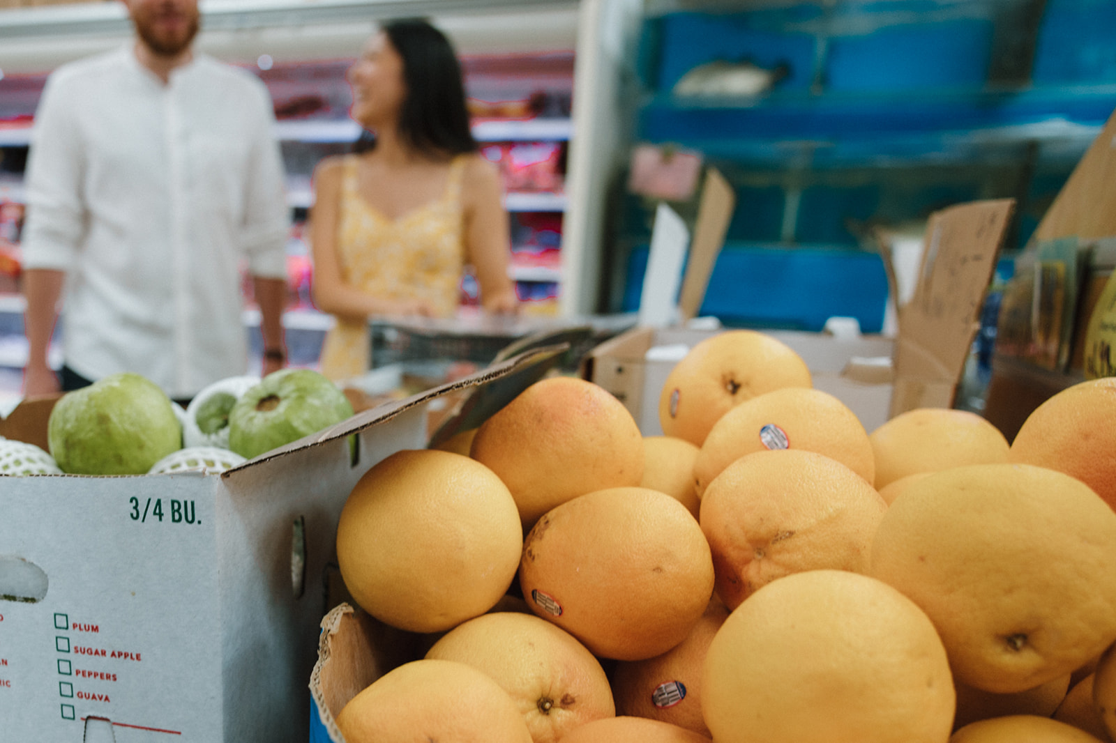 Playful couple takes a photo in a chinatown market!