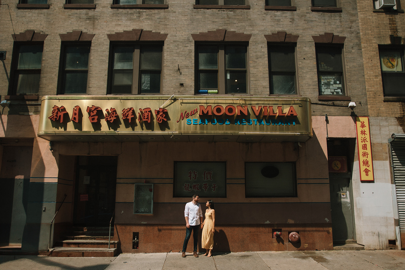 Couple pose outside Moon Villa in Boston's historic chinatown!