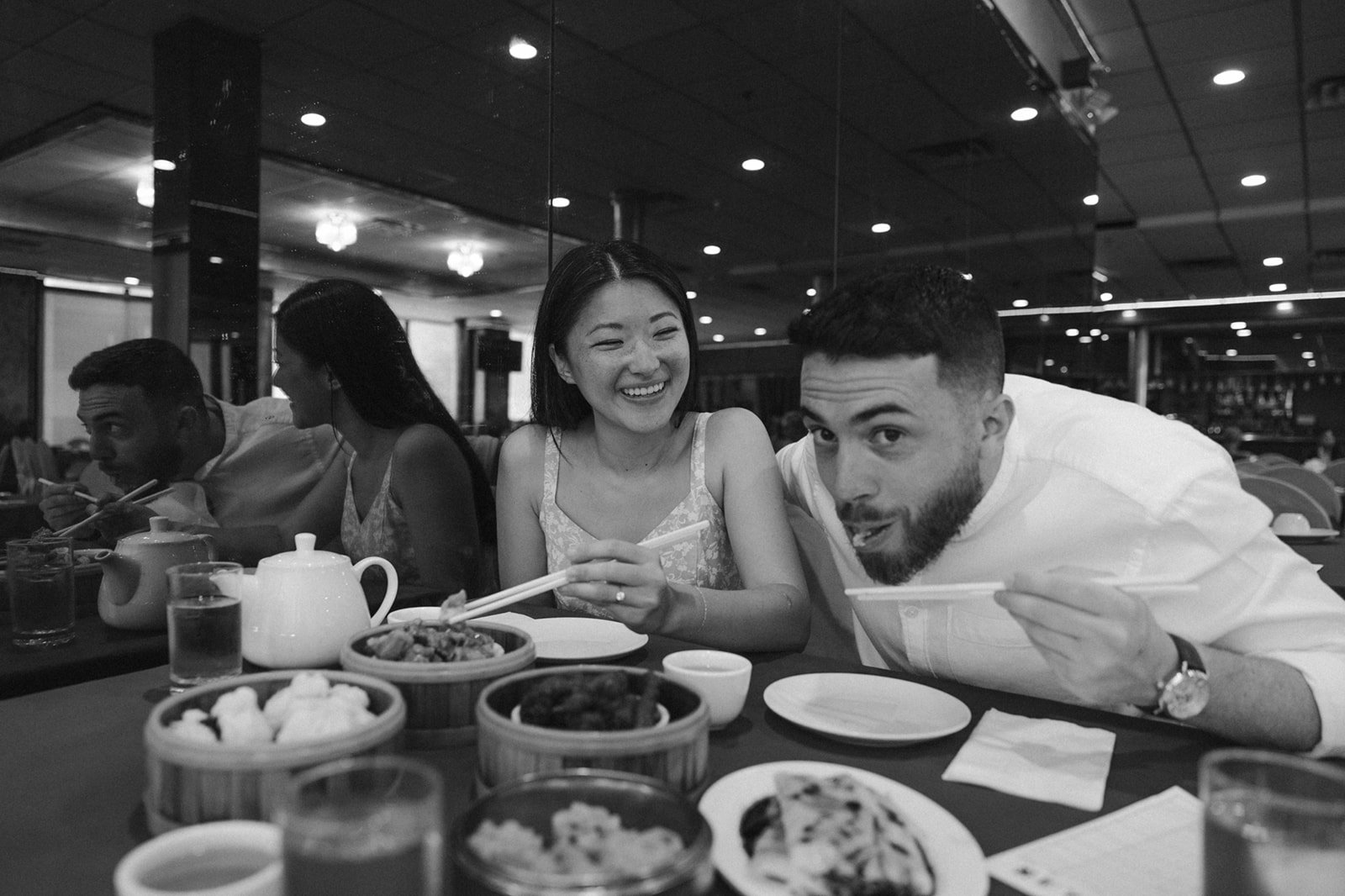 Stunning couple share a traditional Chinese meal during their Boston engagement photos