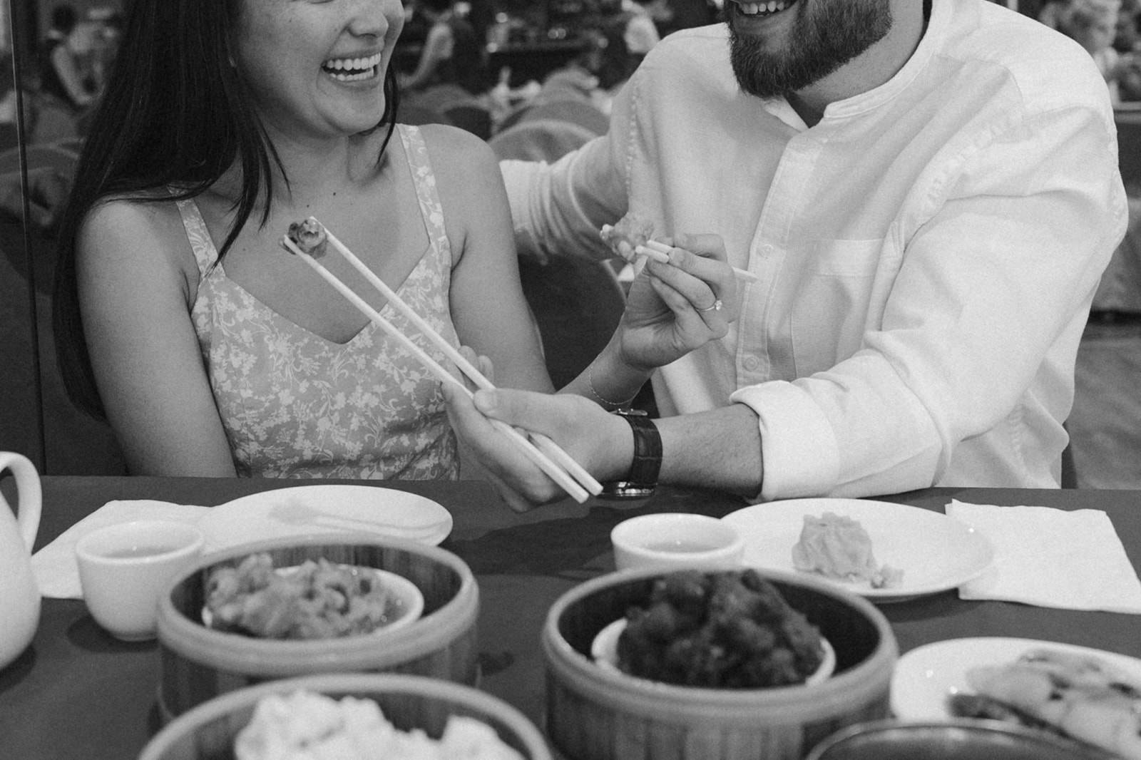 Couple playfully feeds each other during their Boston engagement photoshoot!