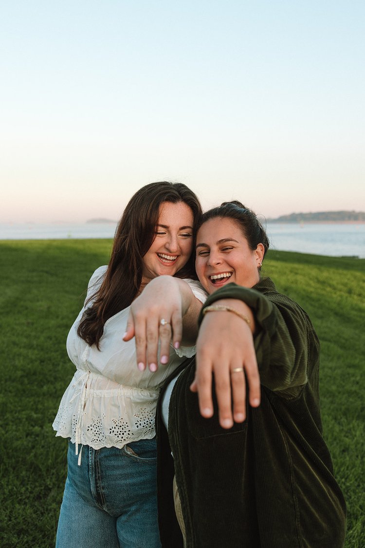 Beautiful couple show off their rings during their castle island engagement photos