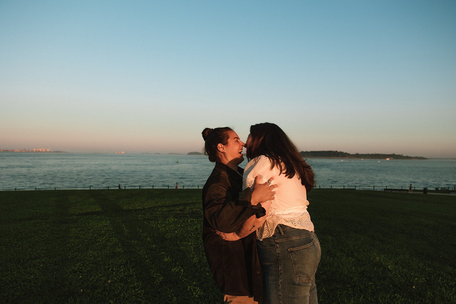 A beautiful couple kisses during their Castle Island engagement photos!