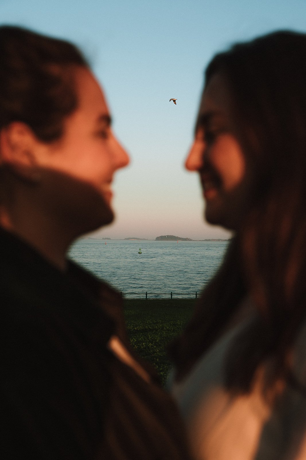 A beautiful couple kisses during their Castle Island engagement photos!