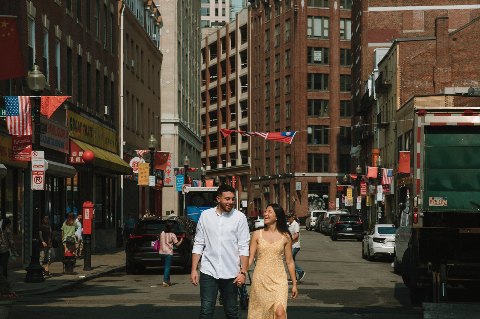 Stunning take a candid walking photo in historic chinatown during their Boston engagement photos! 