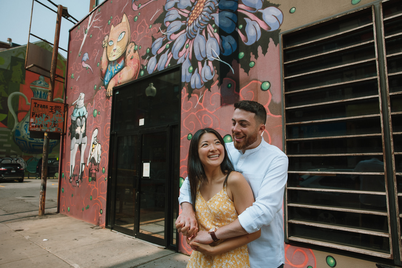 Beautiful couple share an intimate moment in historic Chinatown