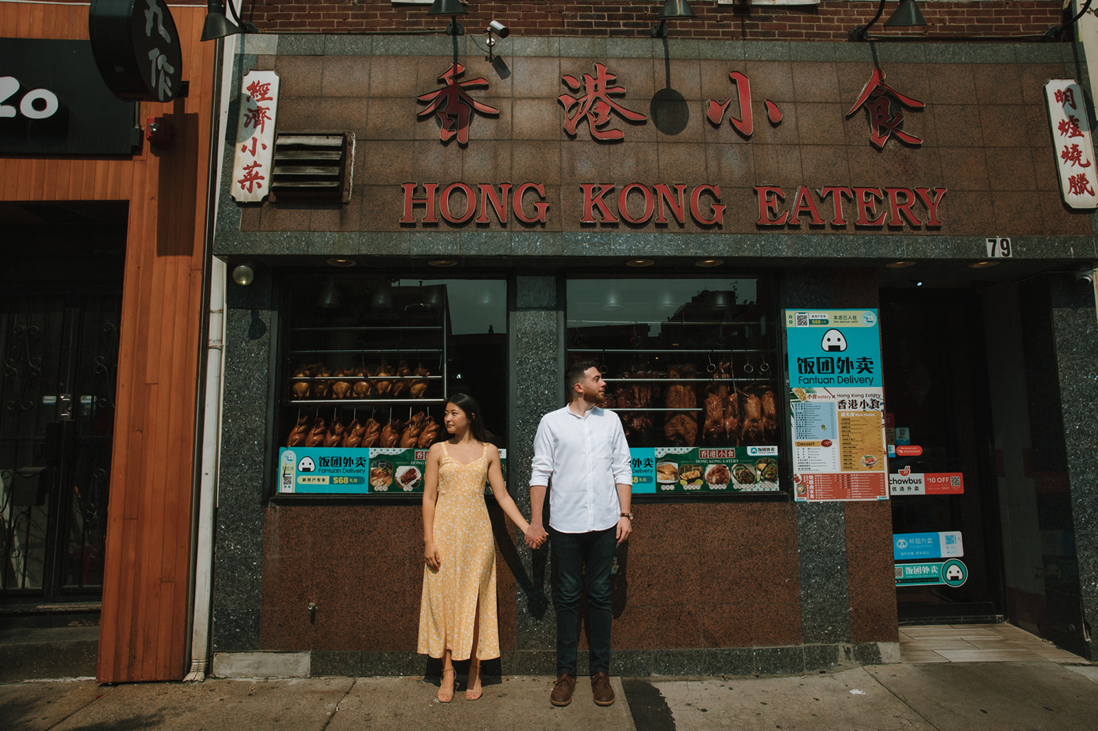 Couple pose holding hands during romantic Boston engagement photos