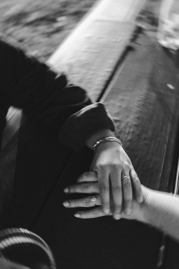 A dreamy couple holding hands during their Boston engagement.