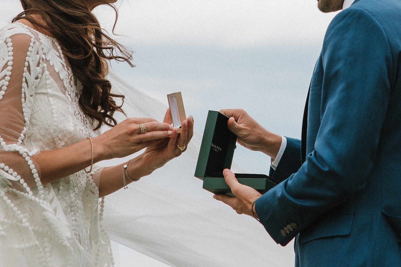 Bride and groom exchange gifts on their dreamy wedding day