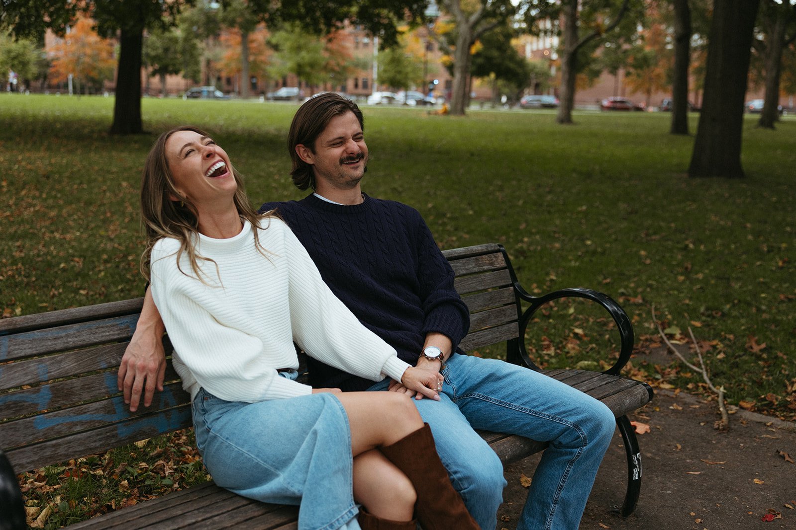 Stunning couple sit together during their Boston engagement photos