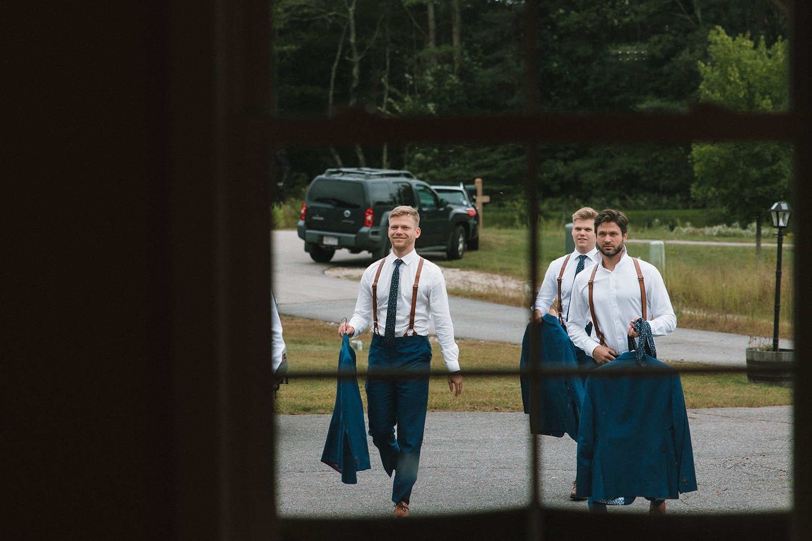 Groomsmen arrive to give a helping hand to the groom on his big day