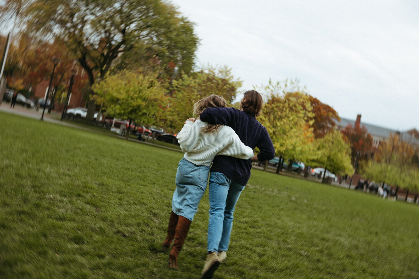 Stunning couple walk together during their Boston engagement photos