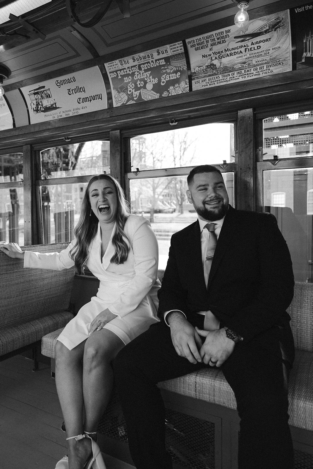 Stunning bride and groom pose on the trolley together