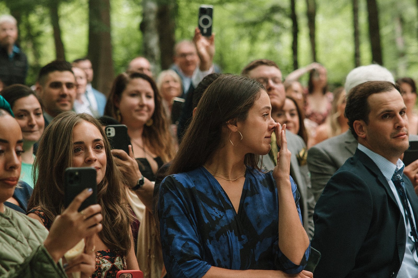 Guests tear up as they capture dreamy wedding moments