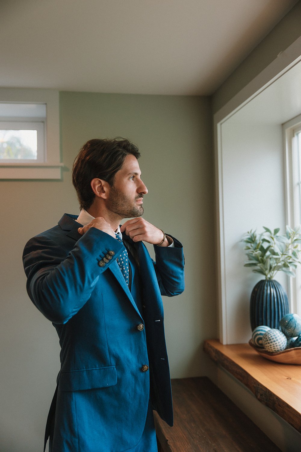 Handsome groom prepares for his dreamy wedding day