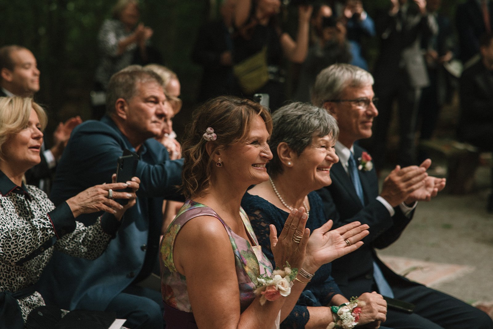 Guests tear up as they capture dreamy wedding moments