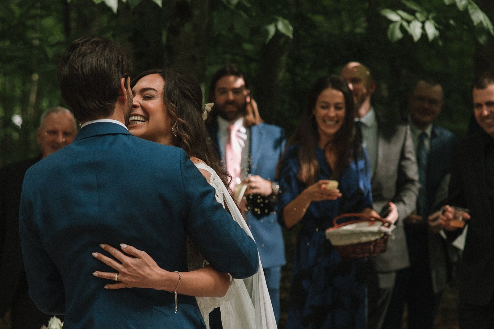 Stunning bride and groom share a kiss as their wedding ceremony ends