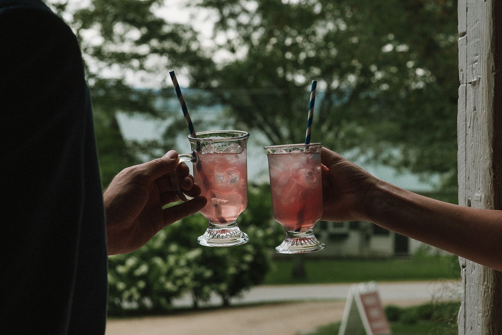 Guests share cocktails during a dreamy spring wedding