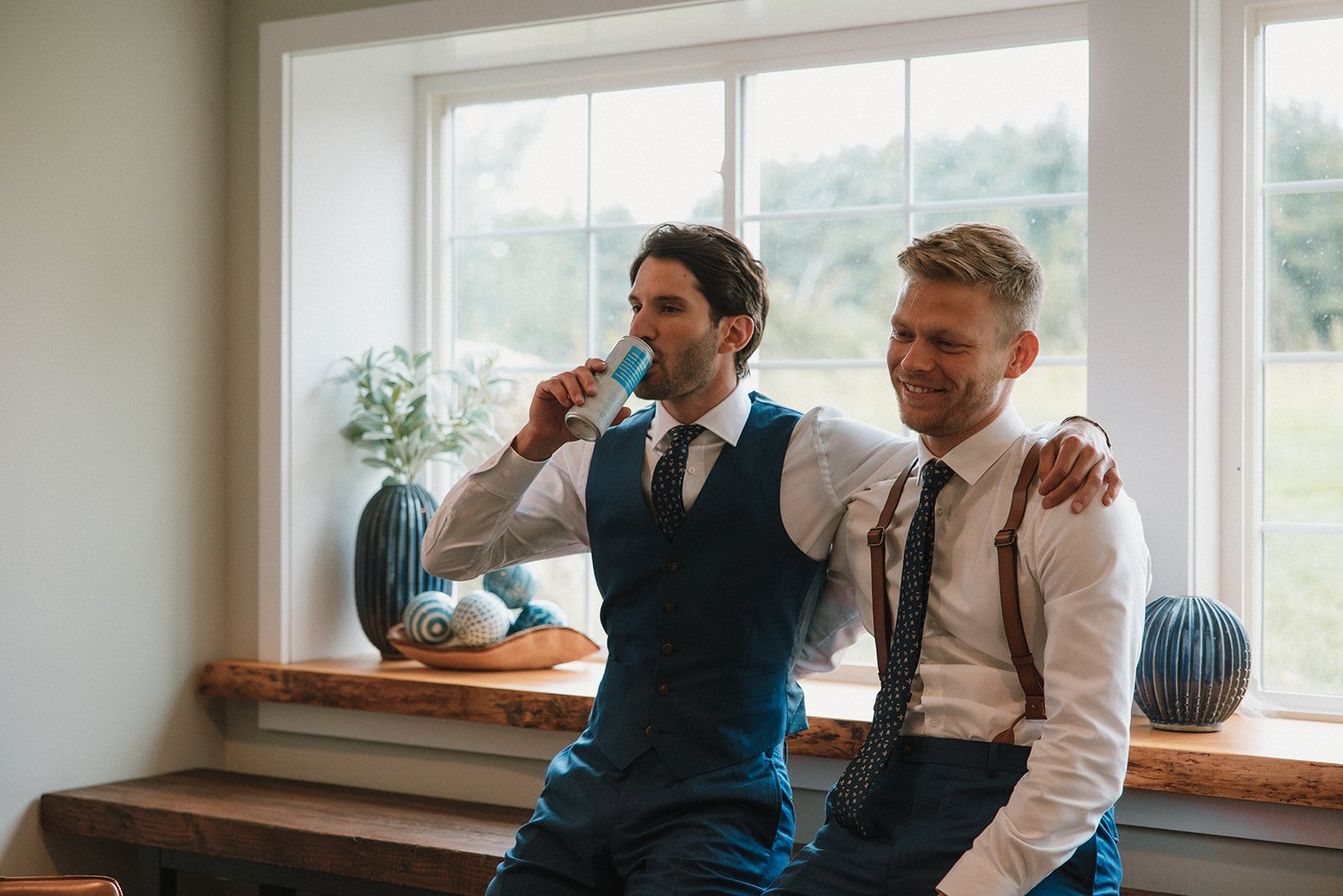 groom poses with his groomsmen before his dreamy wedding day