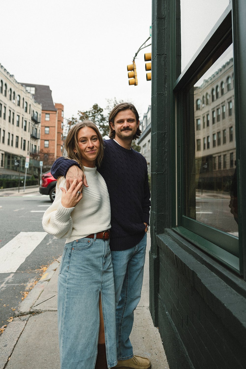 couple pose in downtown cambridge during their fall engagement photoshoot