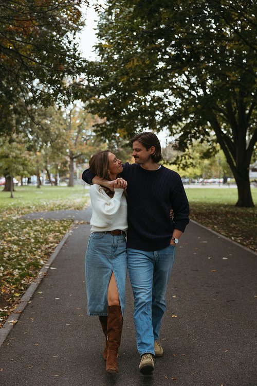 couple pose during their casual engagement photoshoot in cambridge