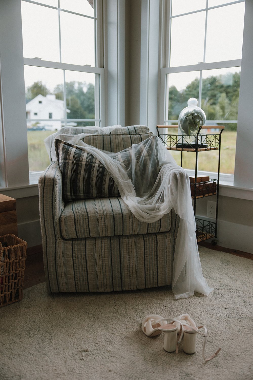 A brides veil and shoes await her as prepares for her dreamy wedding day