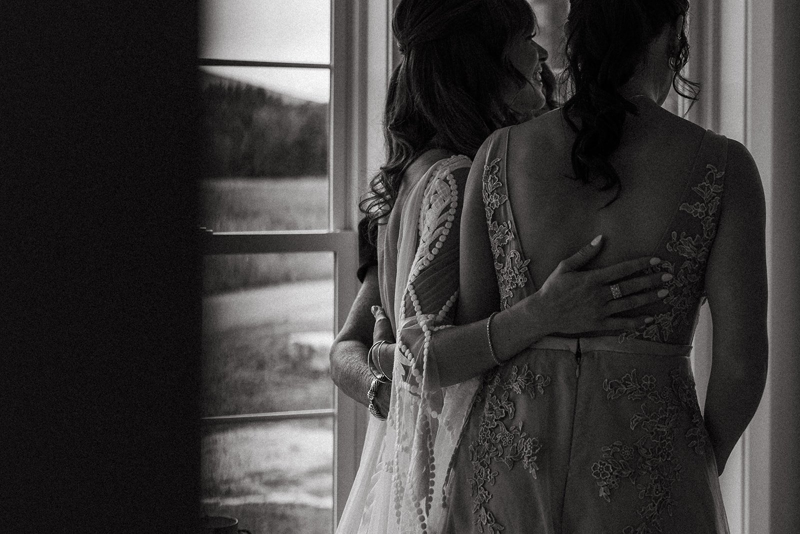 stunning bride poses with her bridemaids before her big day