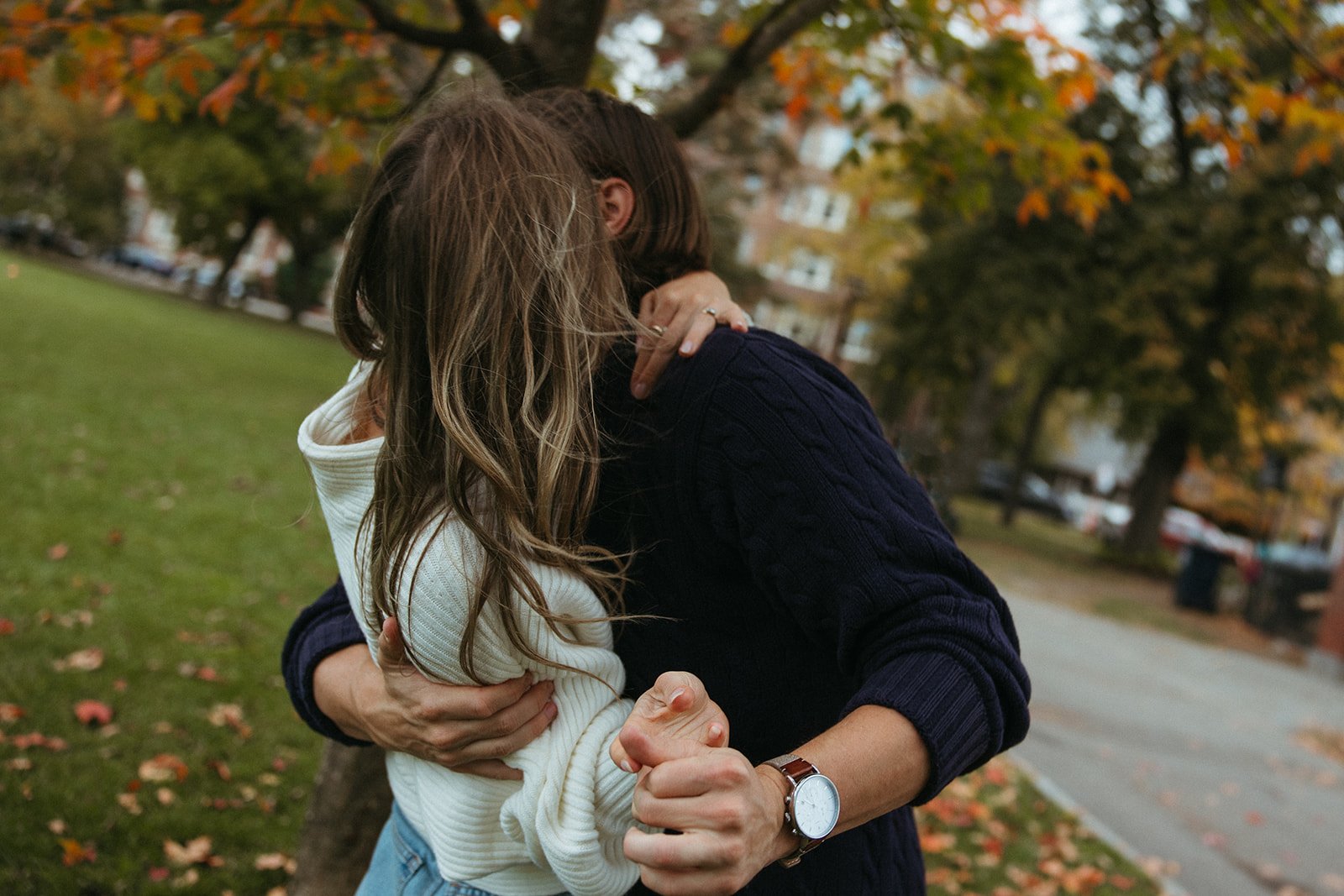 Stunning couple pose together under a colorful tree during their Boston engagement photos