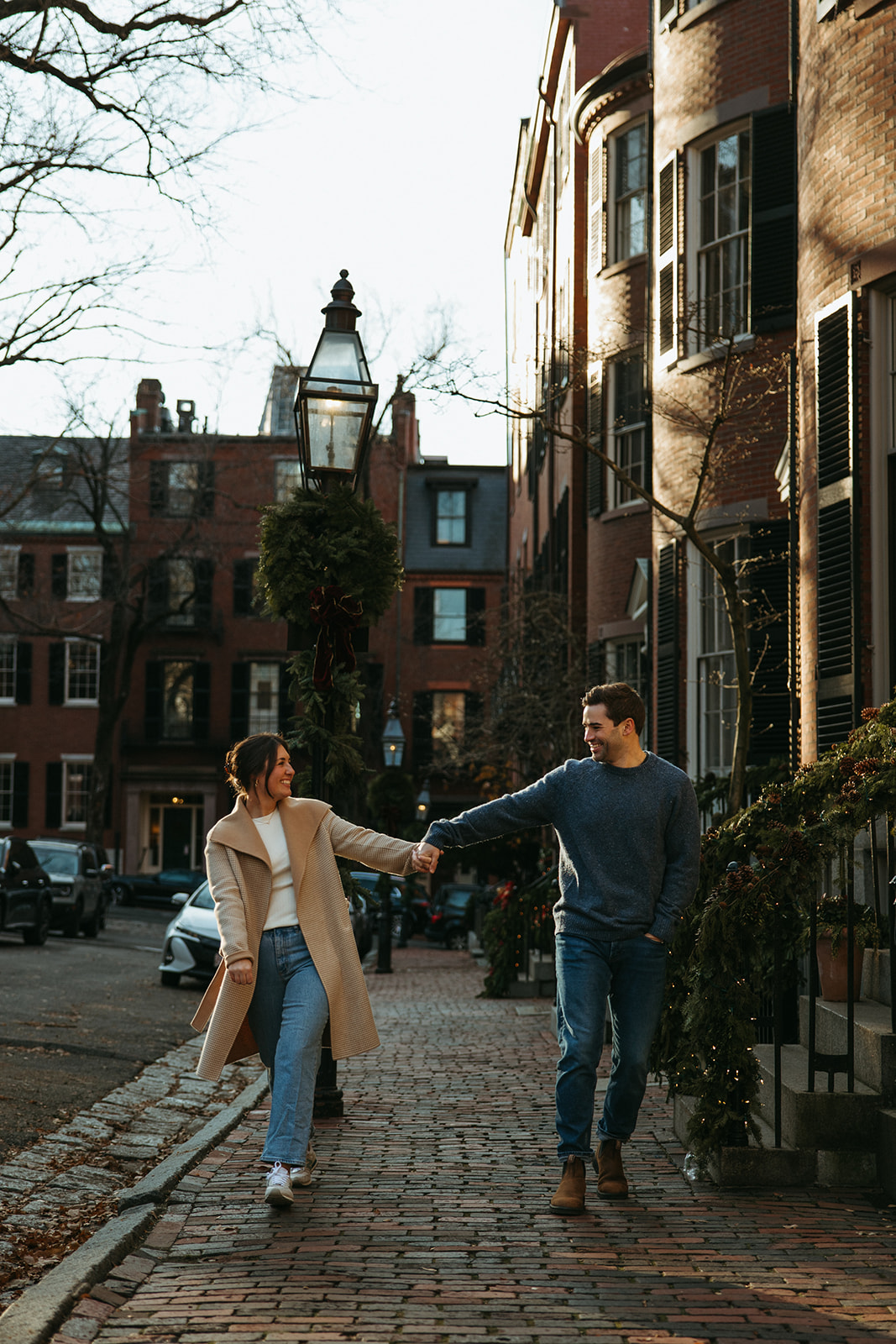 Stunning couple walk together in Boston captured by their Boston wedding photographer