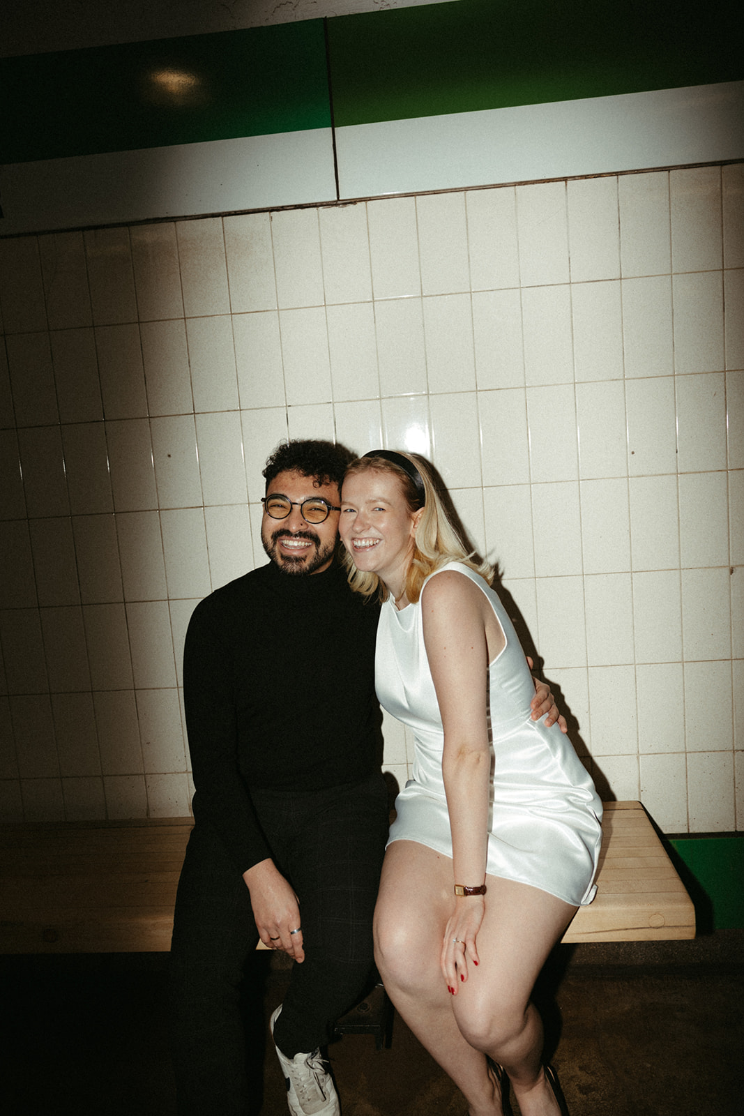 Stunning couple pose with Boston subway in the background