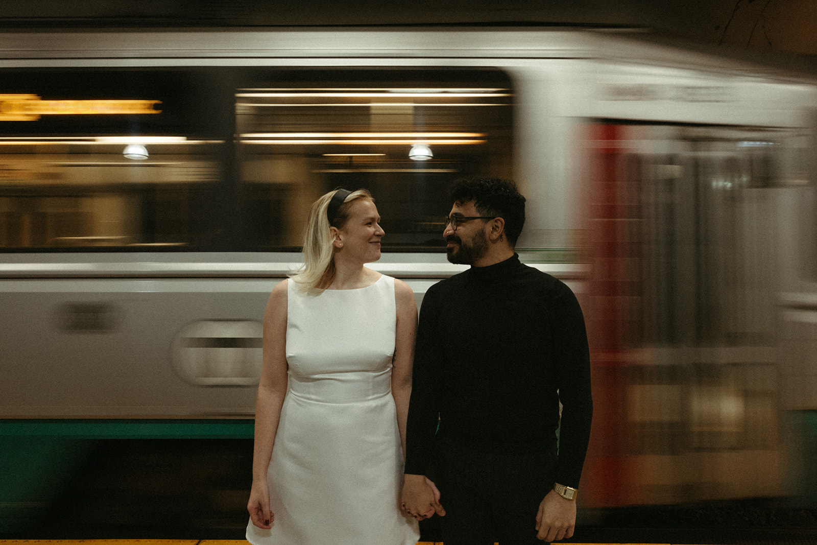 Stunning couple pose with Boston subway in the background