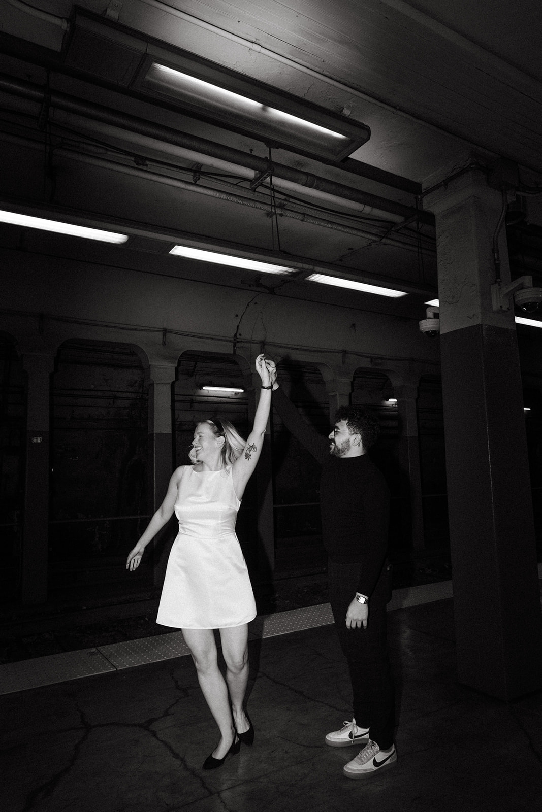 Stunning couple pose with Boston subway in the background