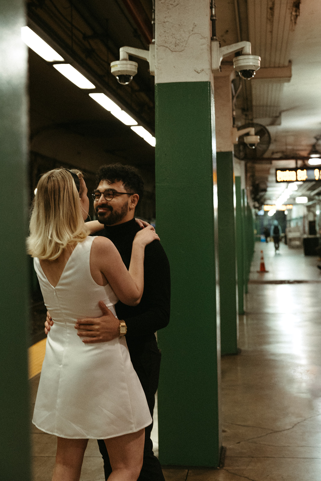 Stunning couple pose with Boston subway in the background