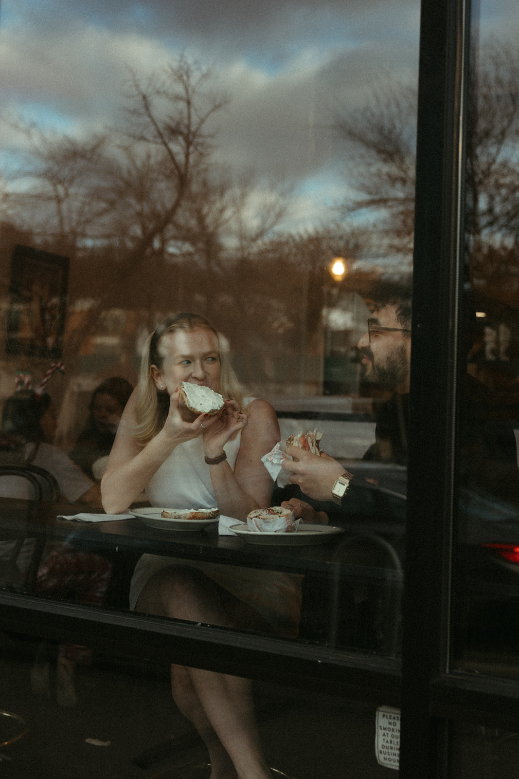 Stunning couple pose in a Boston diner together during their engagement photos in Boston!