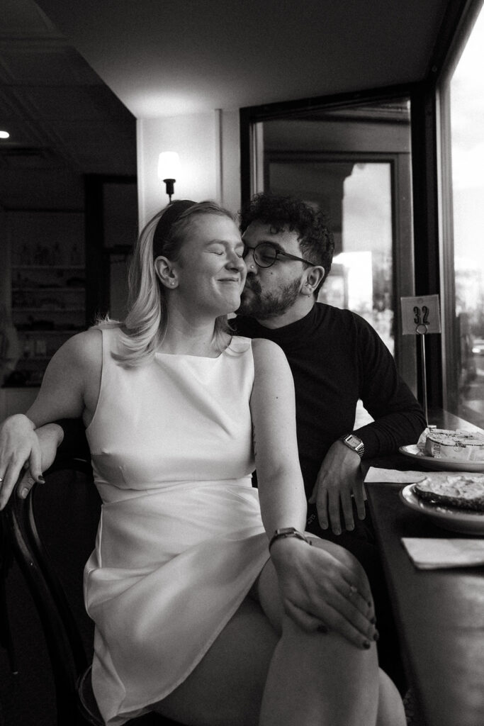 Stunning couple pose in a Boston diner together during their engagement photos in Boston!