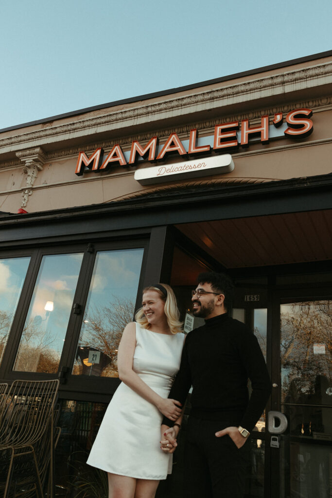 Stunning couple pose in a Boston diner together during their engagement photos in Boston!