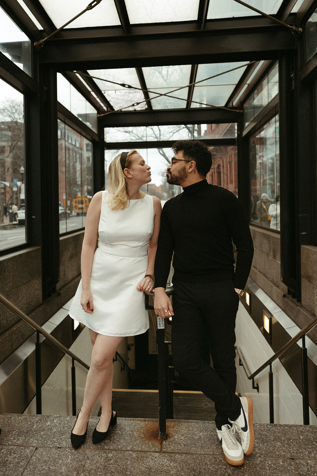 Stunning couple pose with Boston subway in the background