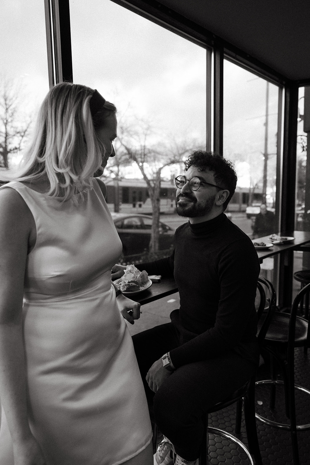 Stunning couple pose in a Boston diner together during their engagement photos in Boston!