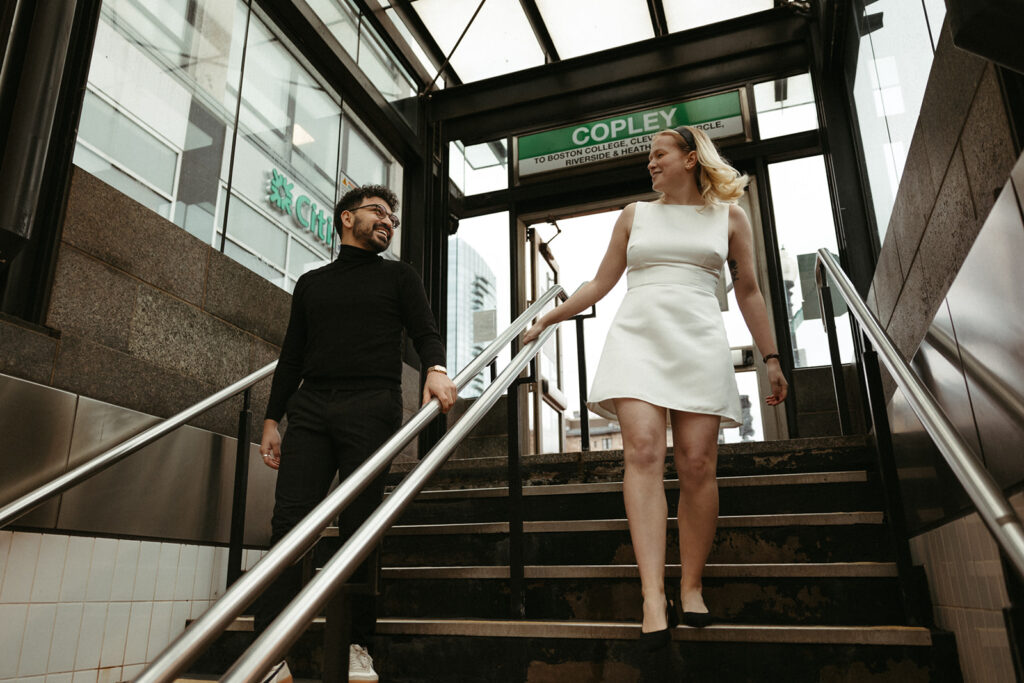 Stunning couple pose with Boston subway in the background