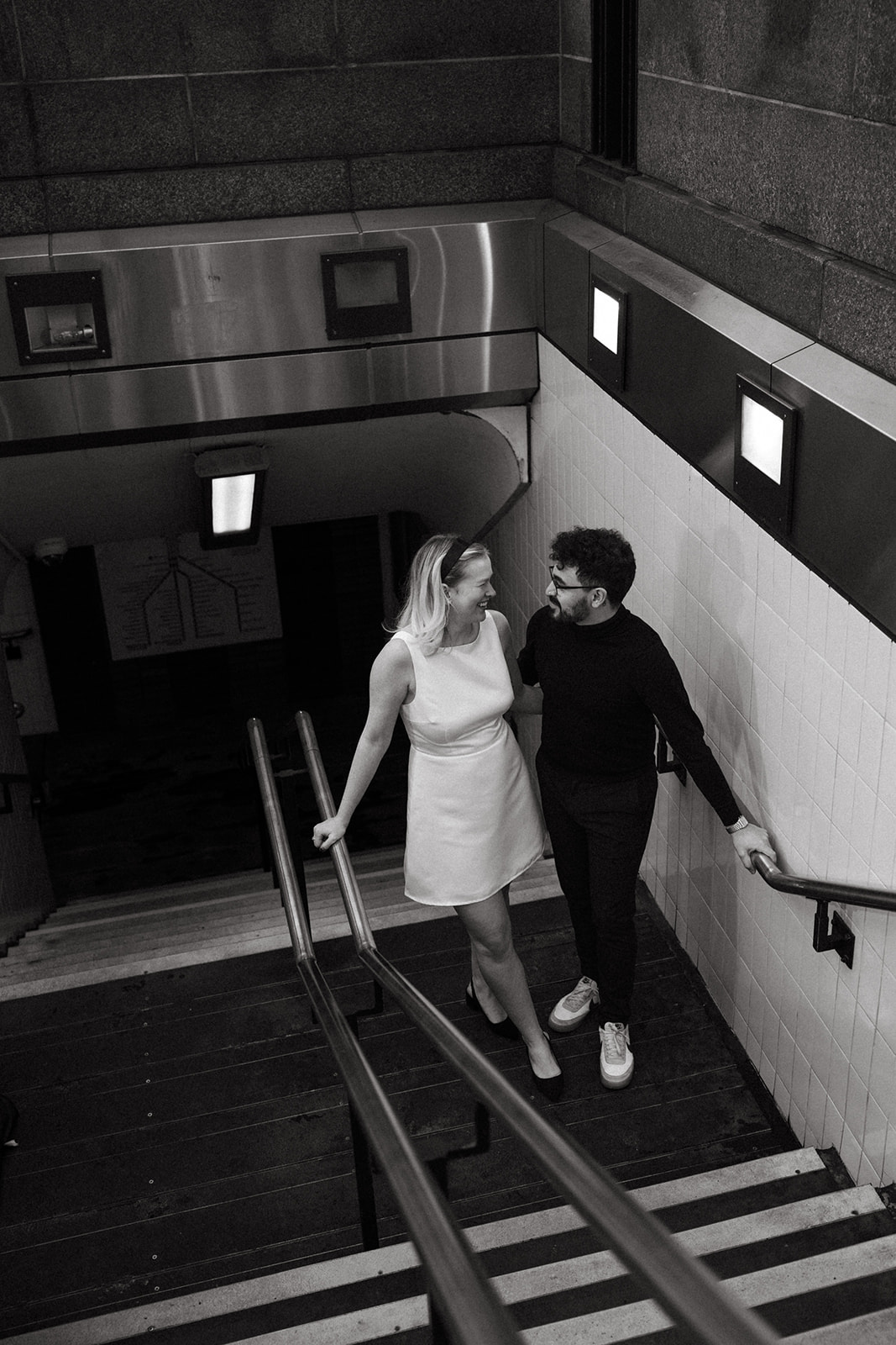 Stunning couple pose with Boston subway in the background