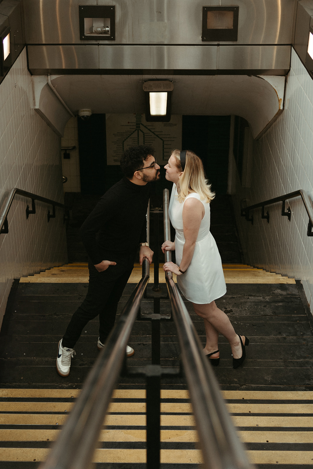 Stunning couple pose with Boston subway in the background