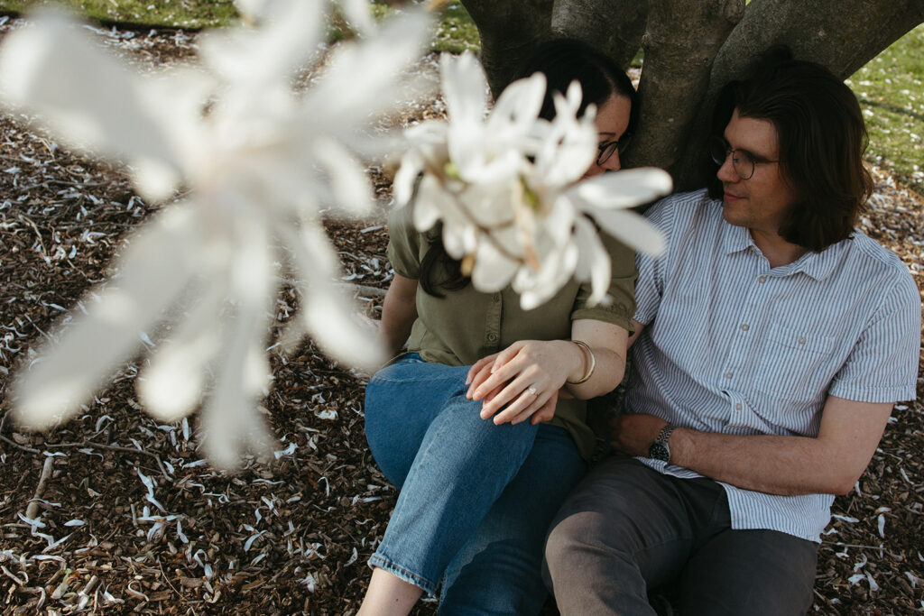 creative engagement ring photos of couple with flowers