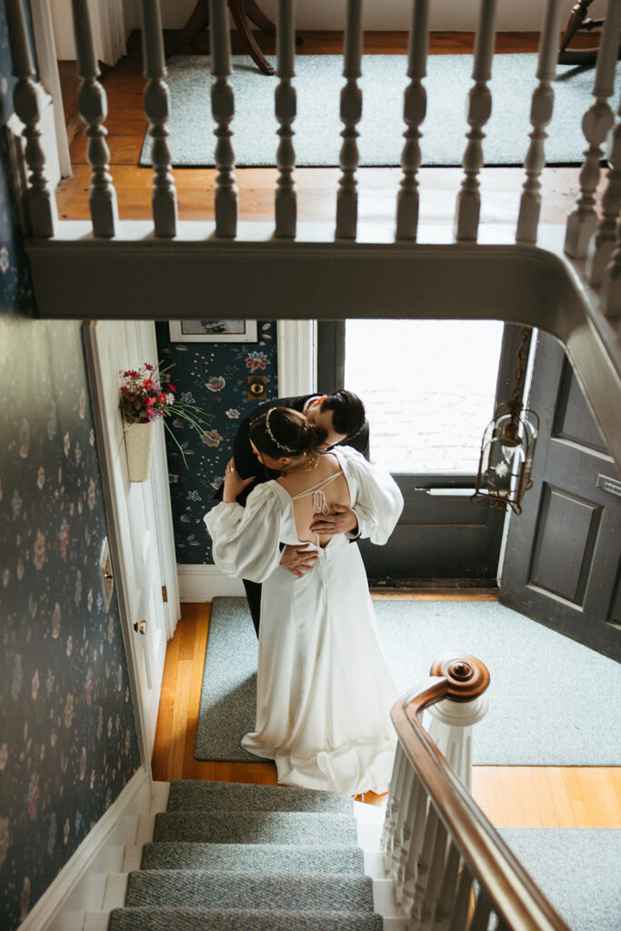 at home wedding first look in staircase