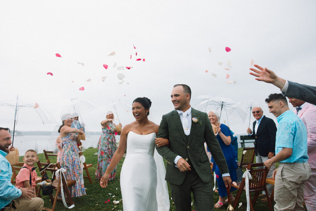 Bride and Groom Rainy Ceremony Exit with Flower Petals