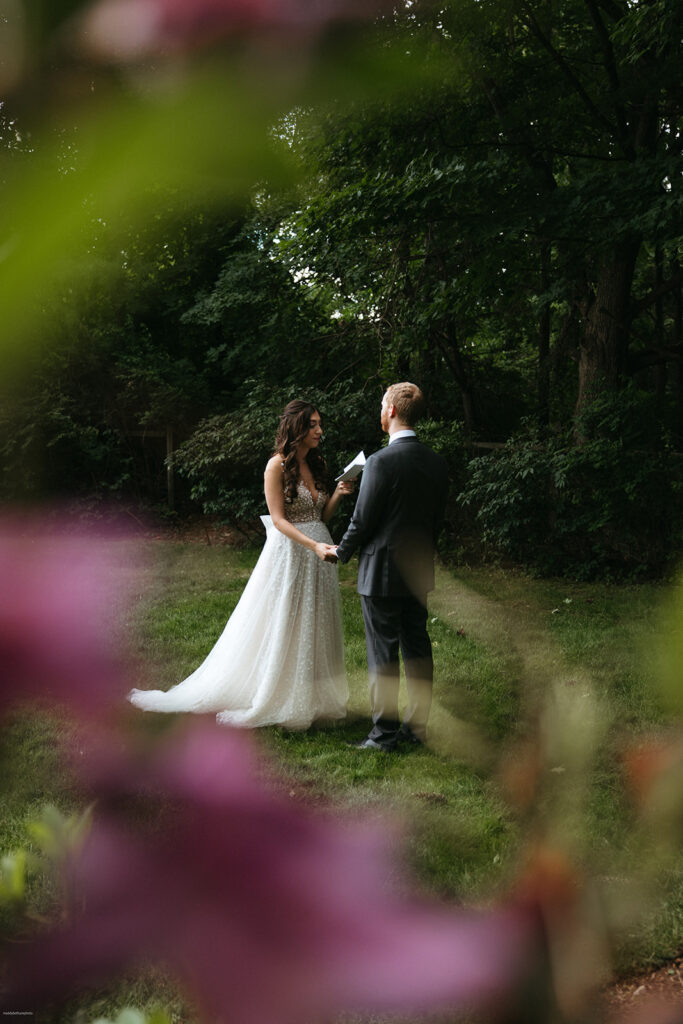 couple reads private vows during first look at summer wedding