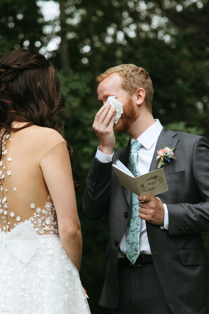 groom cries during private vows at wedding at bedford village inn