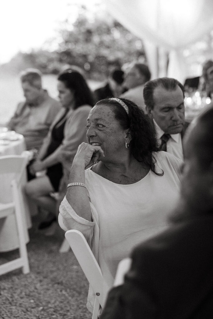 guests listen to toasts during massachusetts wedding 