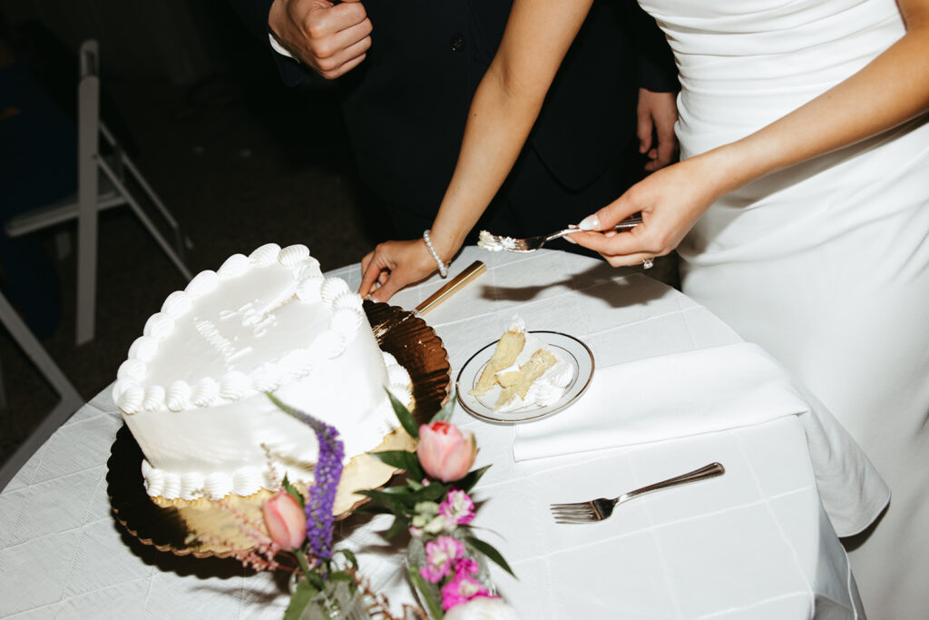 heart-shape vintage white wedding cake cutting